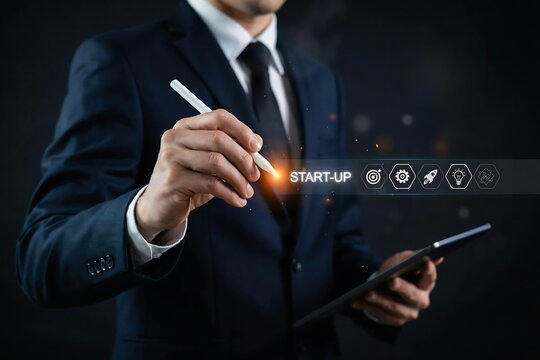Professional businessman using a stylus to interact with a digital start-up business interface