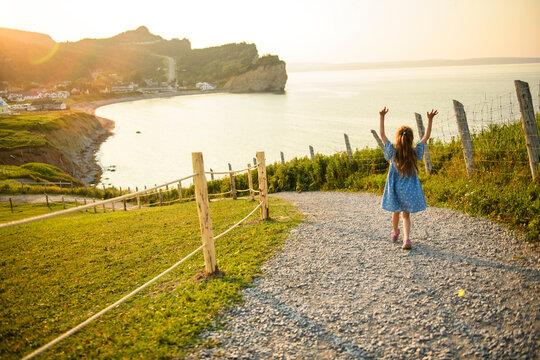 girl enjoying Perce Rock view from Gaspe in Quebec