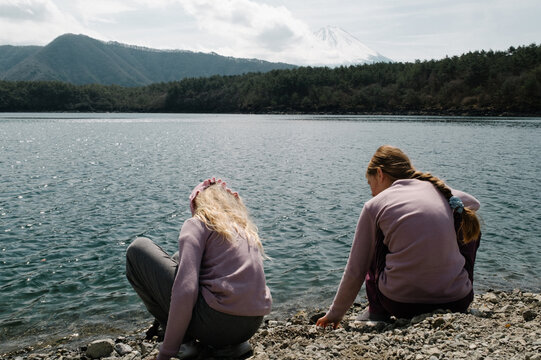 Two girls by the lake at Mount Fuji
