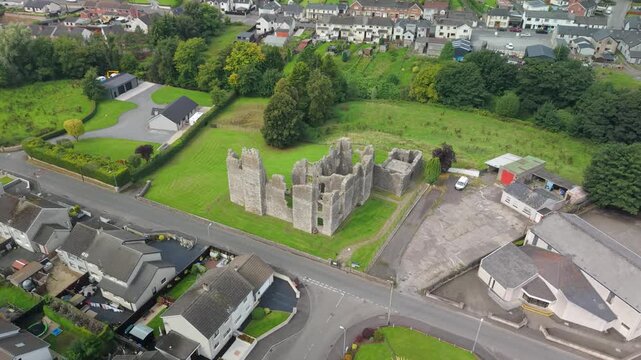 Slow aerial orbit around the 17th century ruins of Castle Caulfield in Castlecaulfield village, County Tyrone, Northern Ireland