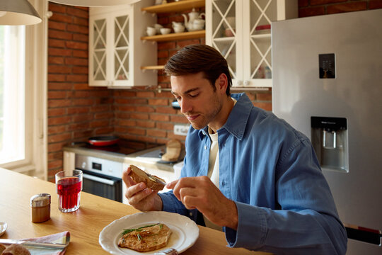 Portrait of a man eats at home