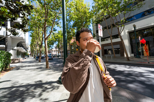 drinking to-go coffee cup on the go sidewalk city lifestyle