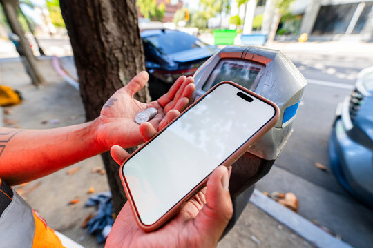 paying parking meter with cellphone tap to pay