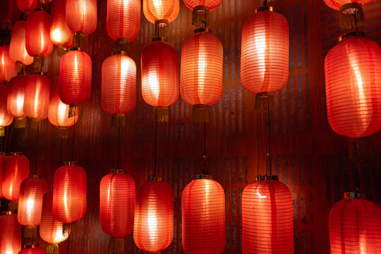 Glowing red Chinese lanterns hanging indoors