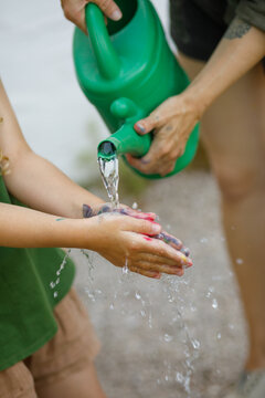 Washing hands after finger painting