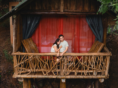 Couple enjoying vacation staying in a rustic treehouse