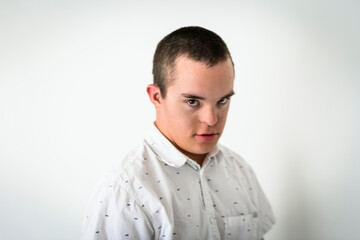 Obraz premium kid with Down syndrome over white background