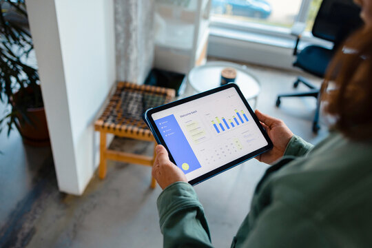 Business Analytics On Tablet at Office