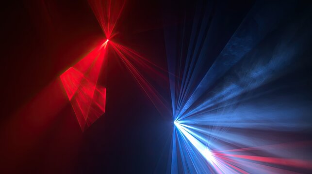 Abstract red and blue laser light beams create a dramatic, smoky, dark atmosphere