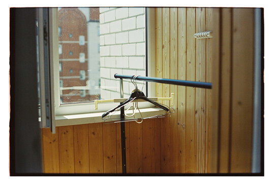 A rack near a window on a balony