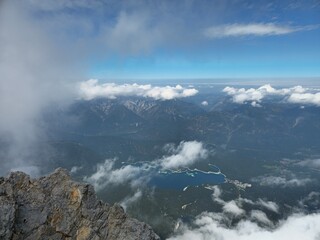 Fototapeta premium Lake Eibsee Below Zugspitze With Clouds and Rocky Ridge
