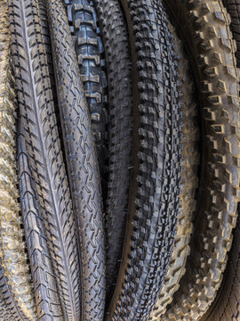 Close-up of Bicycle Tires with Various Tread Patterns