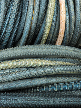 Diverse Collection of Bicycle Tires Stacked Neatly