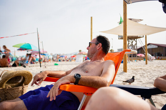 Man relaxing on beach chair