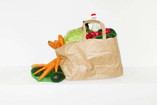 Food grocery store delivery in a brown paper bag in the hallway