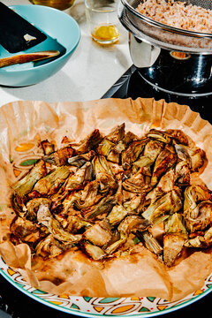 roasted artichoke wedges in a disposable air fryer paper liner
