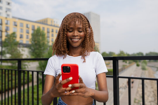 A woman using a mobile phone standing outdoors