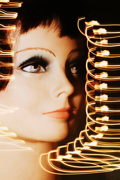 Bright Lights Surround a Mannequin Face at Night