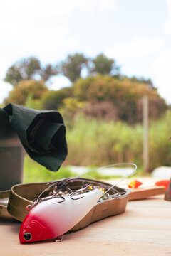 Fishing lure resting on a tackle box, preparing for an exciting day of angling, symbolizing outdoor hobbies, leisure activity, and the pursuit of sport fish in nature