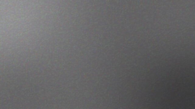 Abstract dark grey gradient noise texture background loop 4k animation video. Minimal dark grey gradient noise texture background loop 4k video.