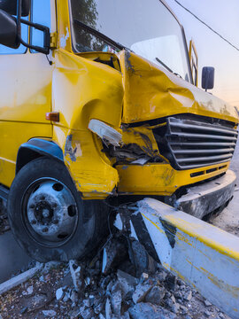 Severely Damaged Yellow Vehicle After Accident in Kyrgyzstan