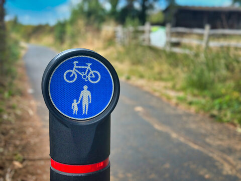 Blue Shared-Use Cycle and Pedestrian Route Post Sign on a Country Path
