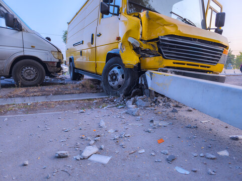 Traffic Accident Scene with Damaged Vans and Debris
