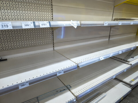 Empty Retail Store Shelves with Price Tags