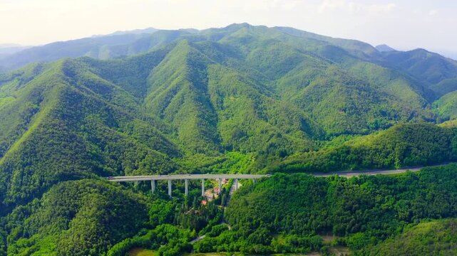 Italy, Province of La Spezia, A12. European route E80 (Trans-European Motorway or TEM). Mountain section with bridges and tunnels. Drone footage