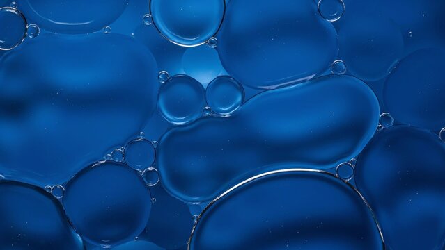 Abstract blue oil and water liquid bubbles macro background texture