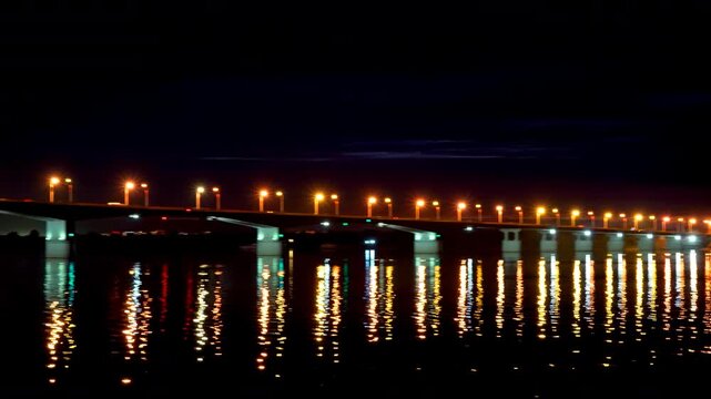 Perm, Russia. Communal bridge over the Kama river in Perm. Night view. The embankment