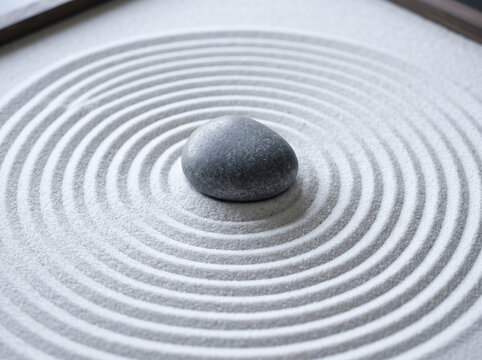 Peaceful Zen Garden with Raked Sand Circles and Balanced Stone