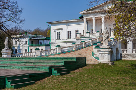 Beautiful scenic view of a historic classic palace building facade with a grand ramp and stone statues