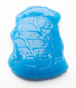 Blue sticky substance shaped like a turtle on white surface