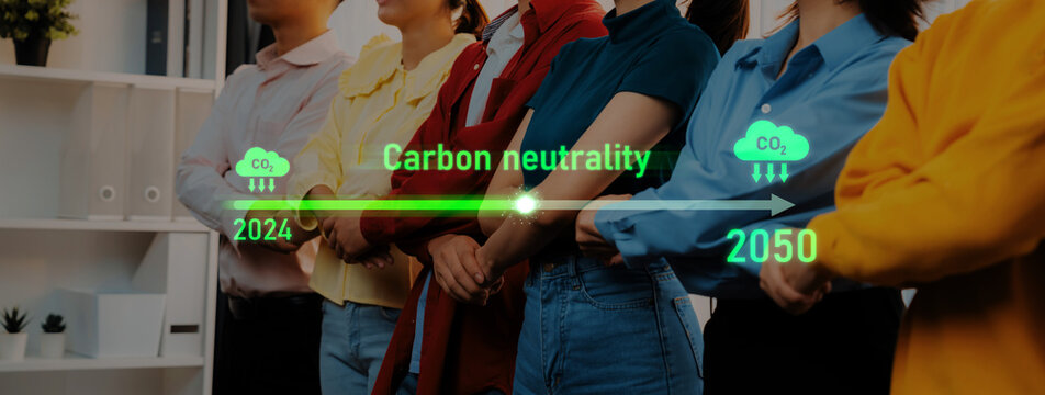 A group of diverse individuals stands together, symbolizing collective commitment to carbon neutrality goals and highlighting the journey from 2024 to 2050. Trope