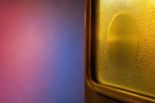 Abstract Frosted Glass Window with Gold Frame and Color Glow