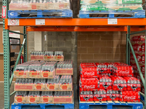 Coca-Cola glass bottles and plastic bottle multipacks displayed for sale at a Costco warehouse in Kalamazoo, Michigan, on August 27, 2026