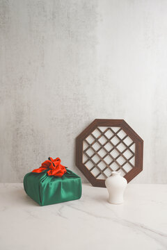 Chuseok and Seollal Greeting Background with Green Bojagi Korean Wrapped Gift Box