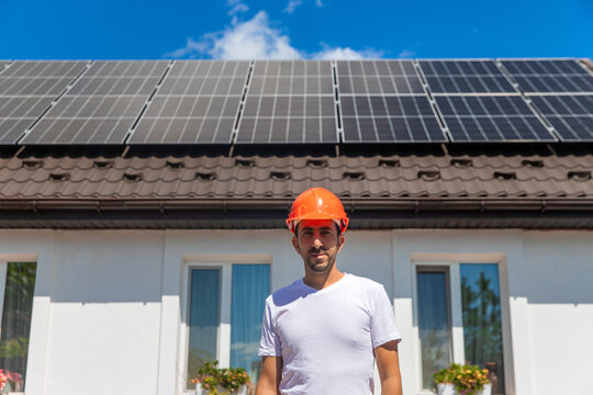 Installing solar panels on a house roof. Selective focus.