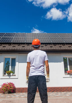 Installing solar panels on a house roof. Selective focus.