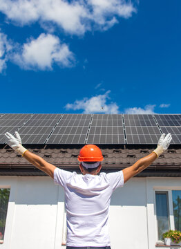 Installing solar panels on a house roof. Selective focus.