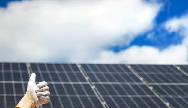 Installing solar panels on a house roof. Selective focus.