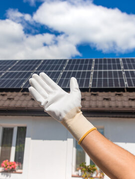 Installing solar panels on a house roof. Selective focus.