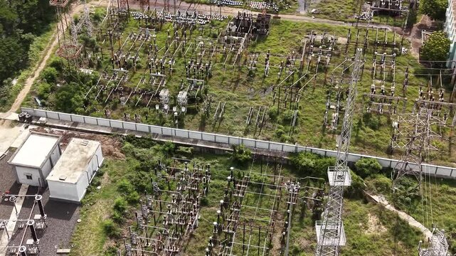 Electrical substation switchyard with insulators and busbars in a green field