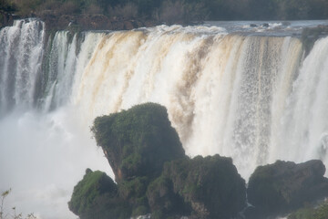 Multiple cascades of Iguazu Falls rising through mist and dense Atlantic Forest in South America © TC2412