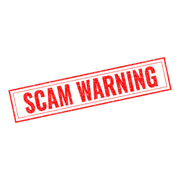 Red rectangular rubber stamp with the text scam warning written in capital letters showing a clear alert message about potential fraud or dangerous activity