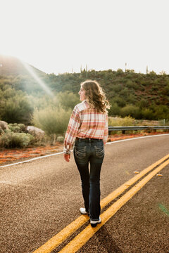 Girl Waking on Desert Street