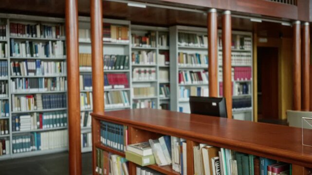 Library shelves and wooden counter, softly blurred bokeh and defocused interior; backplate template overlay calm.