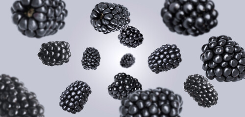 Fresh ripe blackberries spinning in air against grey background © New Africa