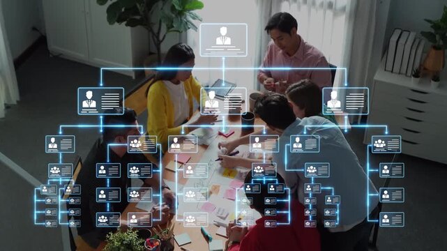 A dynamic team engages in a collaborative meeting, surrounded by digital organizational charts and data visualizations to enhance project planning and management efficiency. Raster